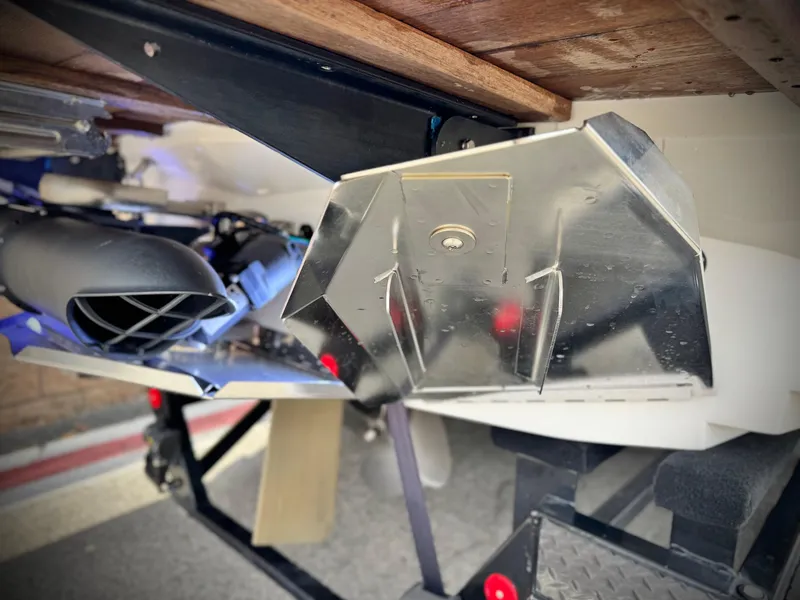 Slide: The Image of 2022 MasterCraft XStar boat underside with metal components and trailer detail. - 7