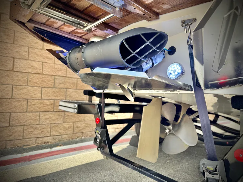 Slide: The Image of 2022 MasterCraft XStar boat stern with propeller and exhaust details. - 8