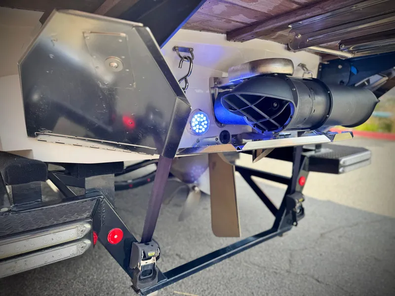 Slide: The Image of 2022 MasterCraft XStar boat stern with advanced propulsion system and underwater lighting. - 9