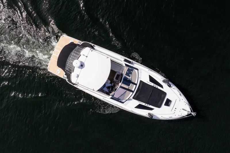 Slide: The Image of Aerial view of 2018 Regal 35 Sport Coupe cruising on dark water. - 16