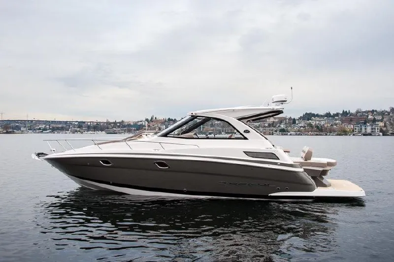 Slide: The Image of 2018 Regal 35 Sport Coupe yacht on calm water, side view. - 18