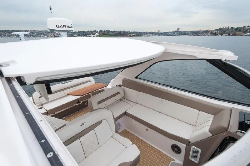 Slide: The Image of 2018 Regal 35 Sport Coupe interior with spacious seating and lake view. - 27