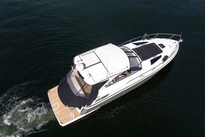 Slide: The Image of 2018 Regal 35 Sport Coupe cruising on open water, aerial view. - 5