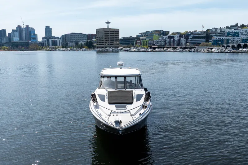 Slide: The Image of 2018 Regal 35 Sport Coupe on water with city skyline in background. - 6