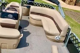 Slide: The Image of 2019 Sun Tracker BASS BUGGY 18 pontoon boat interior with beige seating. - 3
