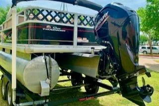 Slide: The Image of 2019 Sun Tracker BASS BUGGY 18 pontoon boat on trailer with outboard motor. - 4