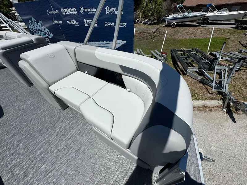 Slide: The Image of 2025 Sweetwater 2286 C boat seating, featuring sleek gray upholstery and modern design. - 13