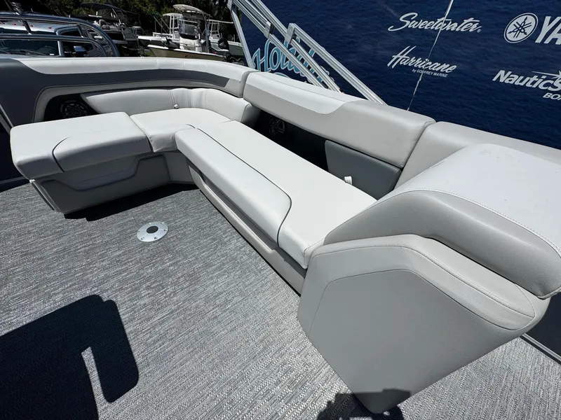 Slide: The Image of Luxurious seating on 2025 Sweetwater 2286 C boat, featuring sleek gray upholstery. - 14