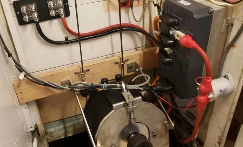 Slide: The Image of Electrical setup inside a 1974 Irwin 37 boat, featuring wiring and components. - 42