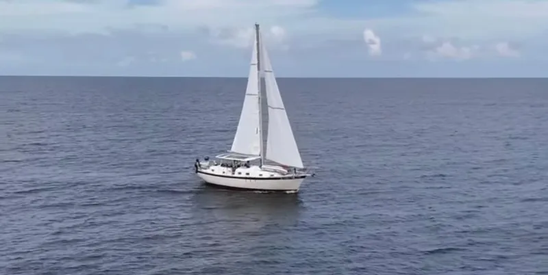 Slide: The Image of Sailboat on open sea, 1974 Irwin 37, under clear skies. - 44