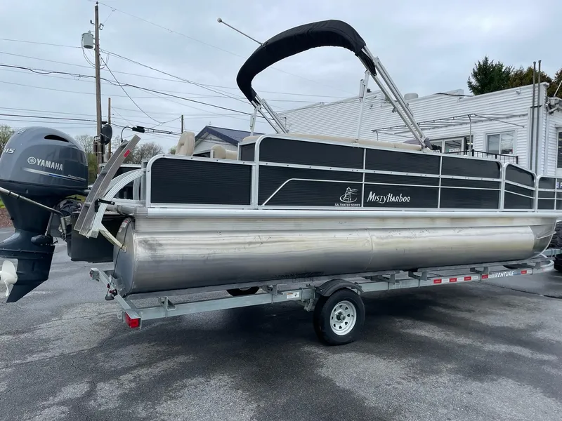 Slide: The Image of 2017 Misty Harbor 245 Adventure CC pontoon boat on trailer, featuring Yamaha outboard motor. - 5