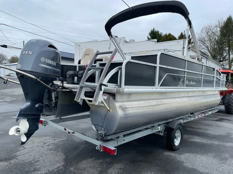 Slide: The Image of 2017 Misty Harbor 245 Adventure CC pontoon boat with Yamaha 115 engine on trailer. - 6