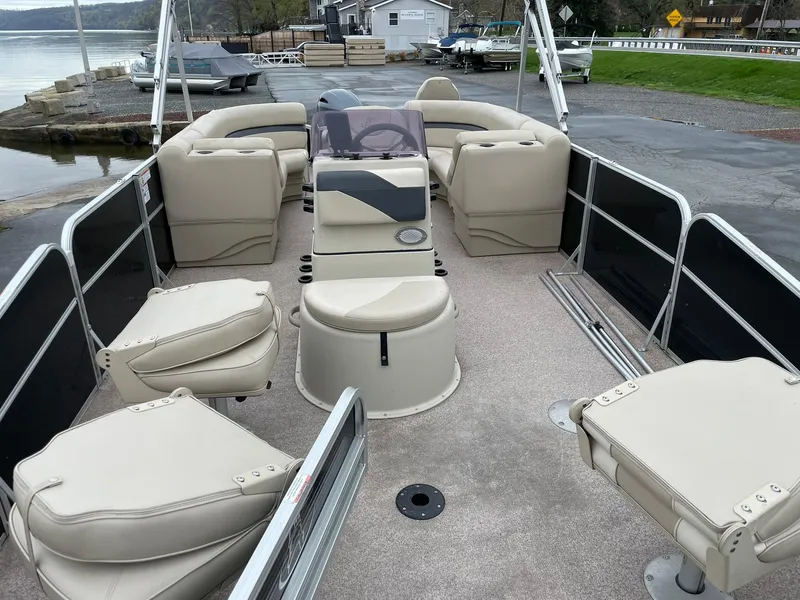 Slide: The Image of 2017 Misty Harbor 245 Adventure CC pontoon boat with beige seating and spacious deck layout. - 9