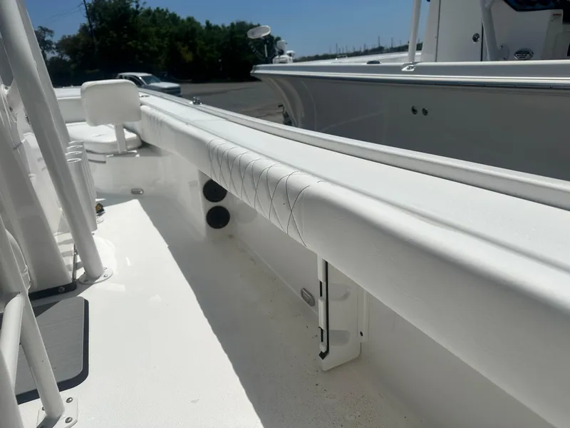 Slide: The Image of 2025 Blazer Bay 2440 boat interior with white seating and sleek design. - 18