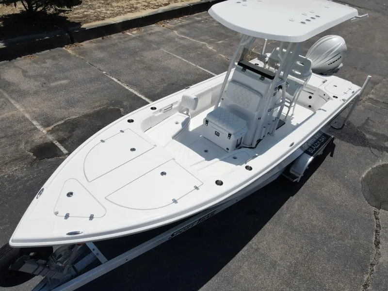 Slide: The Image of 2025 Blazer Bay 2440 boat on trailer, featuring sleek design and spacious deck. - 7