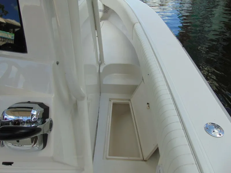 Slide: The Image of 2002 Jupiter 27 Open boat interior with storage compartment and control panel. - 15