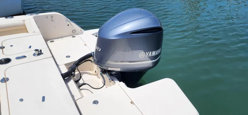 Slide: The Image of 2017 Grady-White Freedom 235 boat with Yamaha outboard motor on calm water. - 17