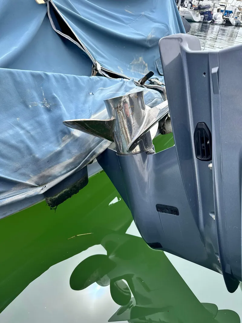 Slide: The Image of 2017 Grady-White Freedom 235 boat with covered outboard motor in marina. - 24