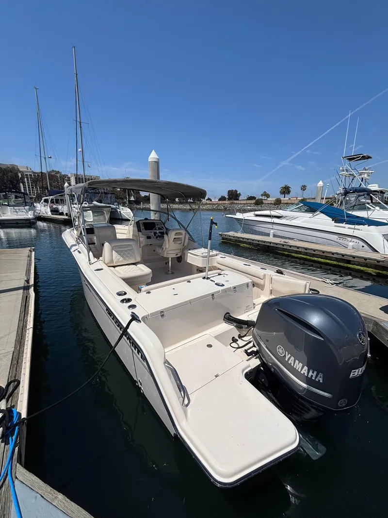 Slide: The Image of 2017 Grady-White Freedom 235 boat docked with Yamaha outboard motor. - 29