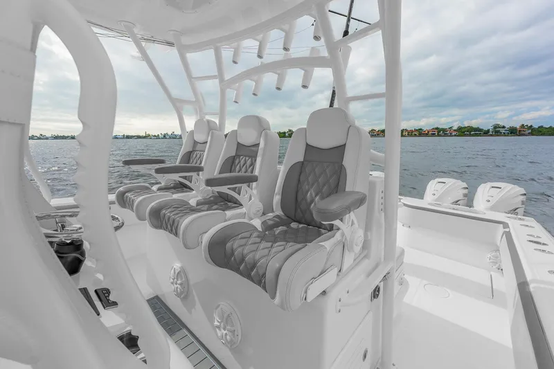 Slide: The Image of Luxury seating on 2022 SeaHunter 41 CTS boat, overlooking serene waters. - 13
