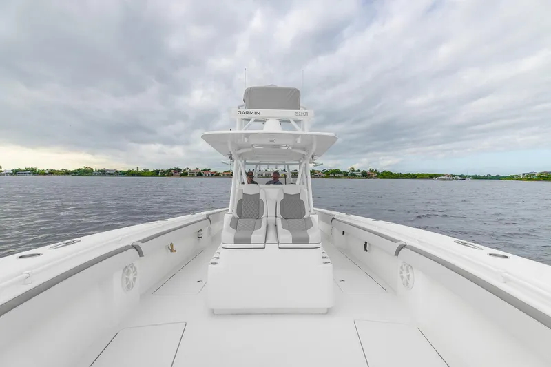 Slide: The Image of 2022 SeaHunter 41 CTS boat on open water under cloudy sky. - 6