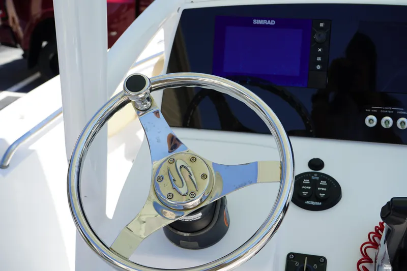 Slide: The Image of Steering wheel and controls of 2016 Sportsman Heritage 211 Center Console boat. - 22