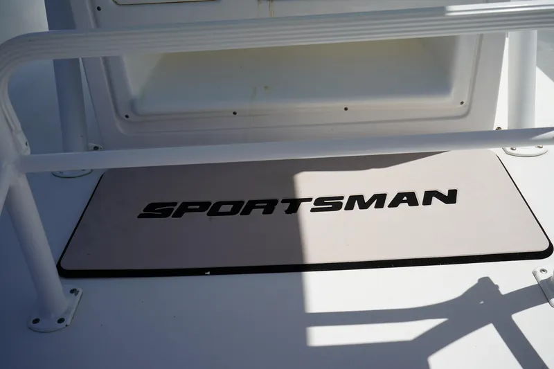 Slide: The Image of 2016 Sportsman Heritage 211 Center Console boat deck with logo mat. - 24
