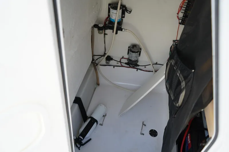 Slide: The Image of 2016 Sportsman Heritage 211 Center Console interior with wiring and equipment. - 29