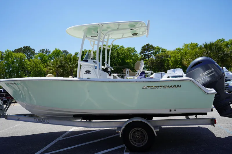 Slide: The Image of 2016 Sportsman Heritage 211 Center Console boat on trailer, parked outdoors. - 3