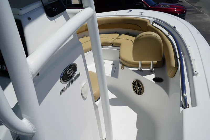 Slide: The Image of 2016 Sportsman Heritage 211 Center Console boat with tan seating and stainless steel railings. - 30