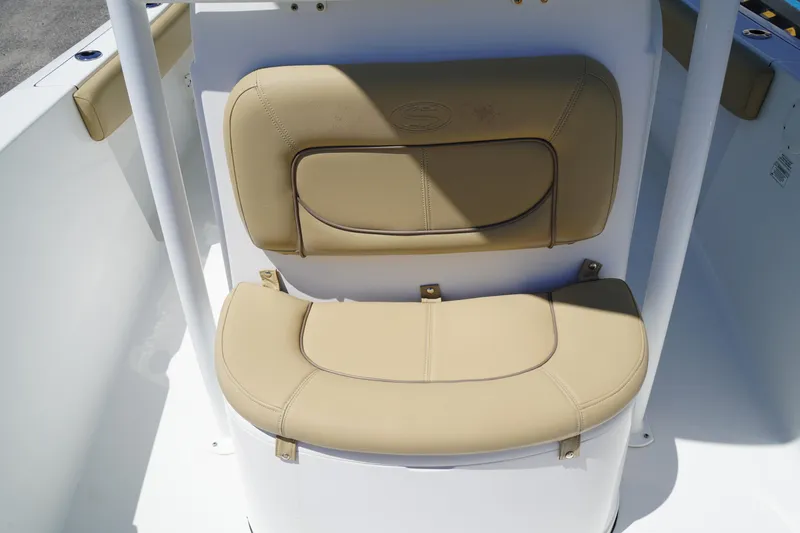 Slide: The Image of 2016 Sportsman Heritage 211 Center Console boat seat, beige upholstery, close-up view. - 31
