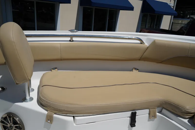Slide: The Image of 2016 Sportsman Heritage 211 Center Console boat with beige seating and stainless steel railing. - 33
