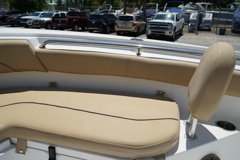 Slide: The Image of 2016 Sportsman Heritage 211 Center Console boat with tan seating and stainless steel rail. - 34