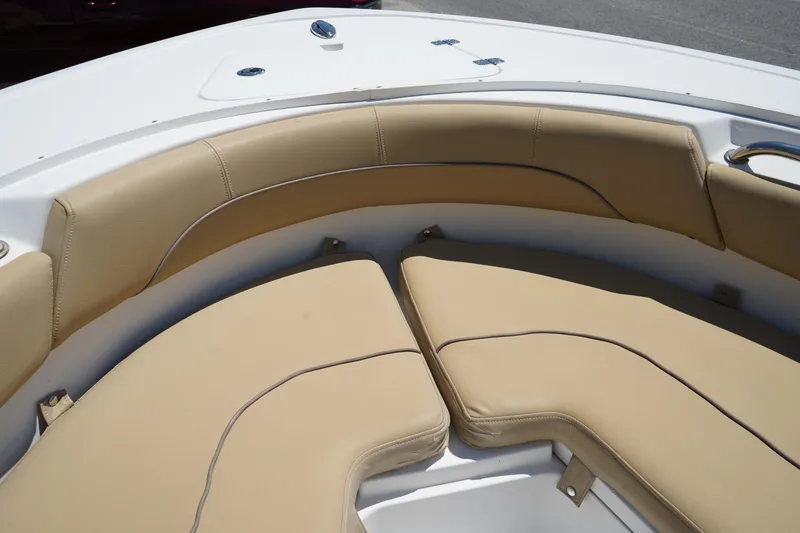 Slide: The Image of 2016 Sportsman Heritage 211 Center Console boat with tan cushioned seating. - 35