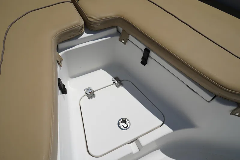 Slide: The Image of 2016 Sportsman Heritage 211 Center Console storage compartment with cushioned seating. - 37