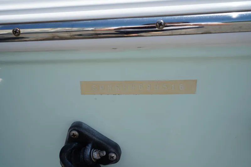 Slide: The Image of 2016 Sportsman Heritage 211 Center Console boat detail with identification plate. - 41