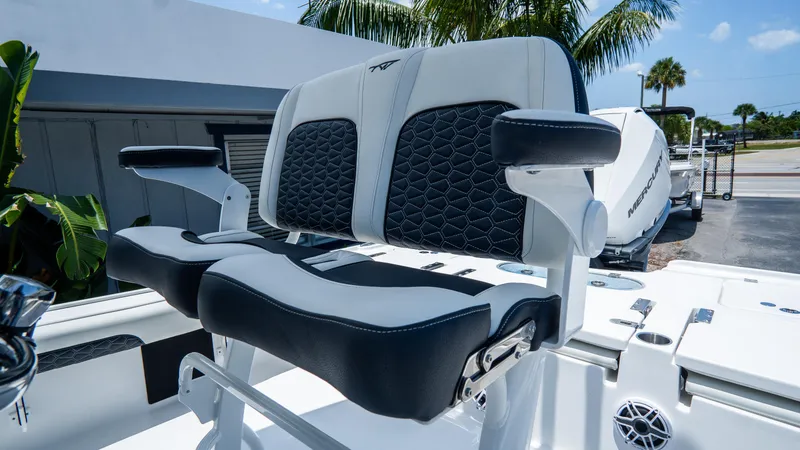 Slide: The Image of 2025 Tidewater 2500 Carolina Bay boat seating with armrests, featuring modern design and comfort. - 15