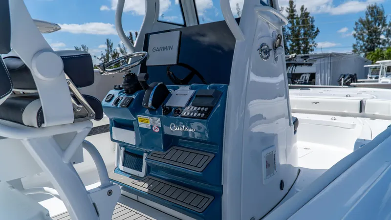 Slide: The Image of 2025 Tidewater 2500 Carolina Bay boat console with Garmin navigation system. - 16