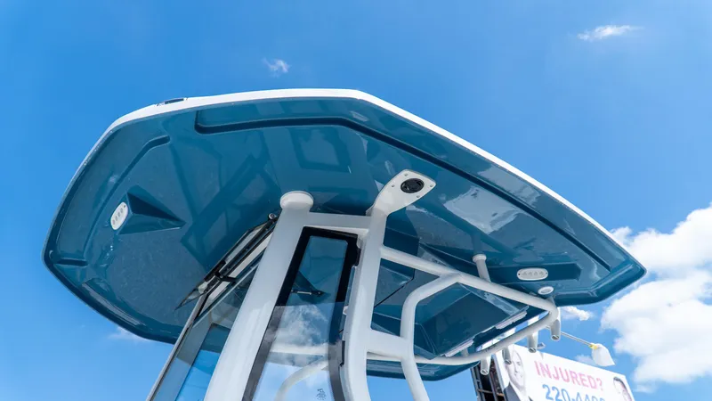 Slide: The Image of 2025 Tidewater 2500 Carolina Bay boat canopy against a clear blue sky. - 20