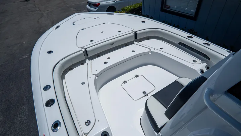 Slide: The Image of 2025 Tidewater 2500 Carolina Bay boat interior with spacious seating and storage compartments. - 23