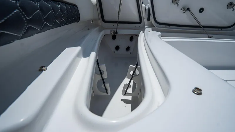 Slide: The Image of 2025 Tidewater 2500 Carolina Bay boat interior storage compartments. - 26