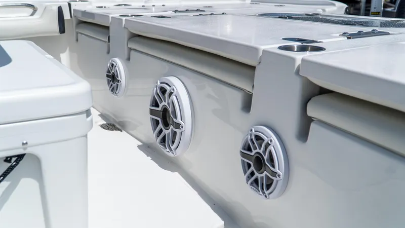 Slide: The Image of 2025 Tidewater 2500 Carolina Bay boat interior with built-in speakers and storage compartments. - 9