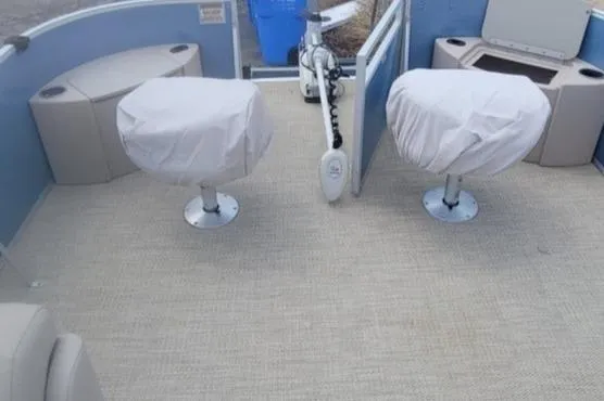 Slide: The Image of 2016 Bennington 21SFX boat interior with covered seats and fishing equipment. - 5