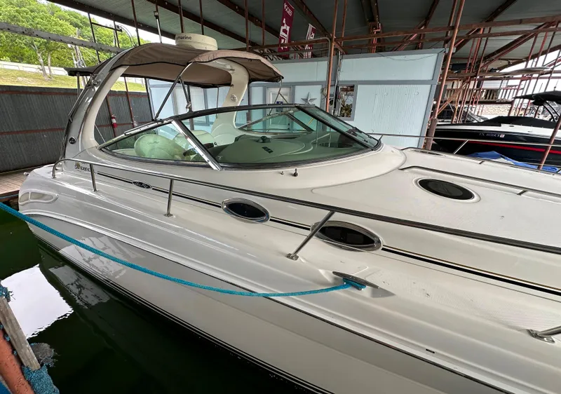 Slide: The Image of 2002 Sea Ray 360 Sundancer yacht docked in a covered marina. - 14