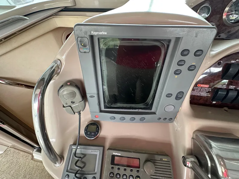 Slide: The Image of Control panel of a 2002 Sea Ray 360 Sundancer boat with navigation equipment. - 27