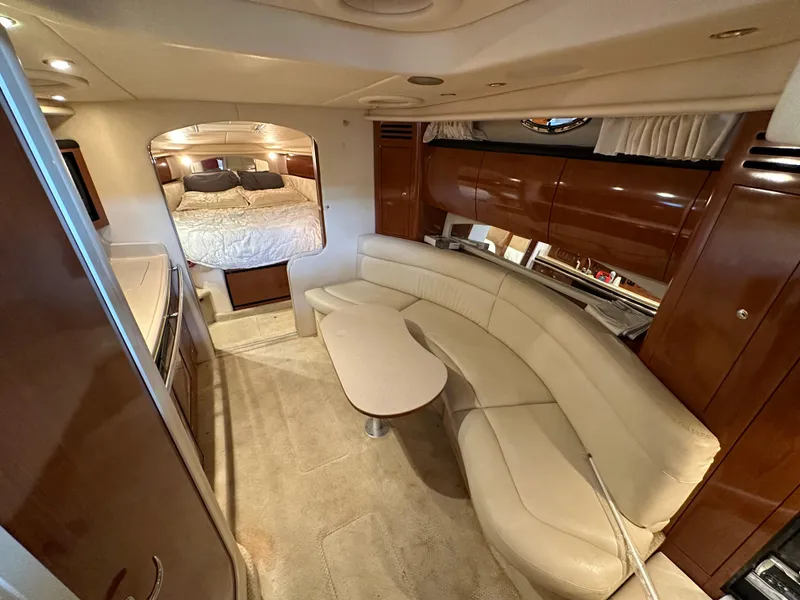 Slide: The Image of Luxurious interior of 2002 Sea Ray 360 Sundancer yacht with elegant seating and cozy bedroom. - 33