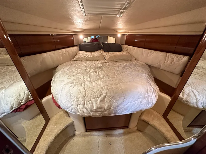 Slide: The Image of Luxurious cabin interior of 2002 Sea Ray 360 Sundancer with cozy bedding. - 40