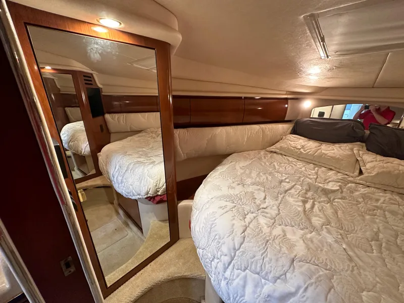 Slide: The Image of Interior of 2002 Sea Ray 360 Sundancer with cozy bed and mirrored closet. - 43