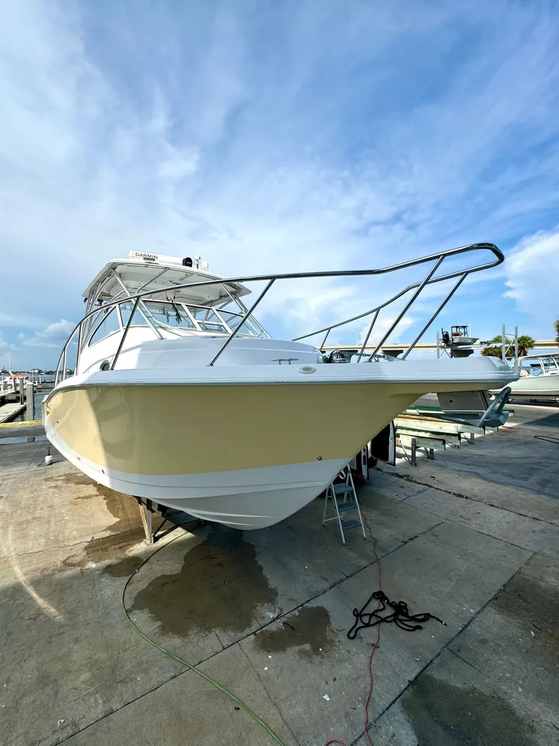 Slide: The Image of 2005 Pro-Line 32 Express boat docked, showcasing sleek design and sturdy build. - 4