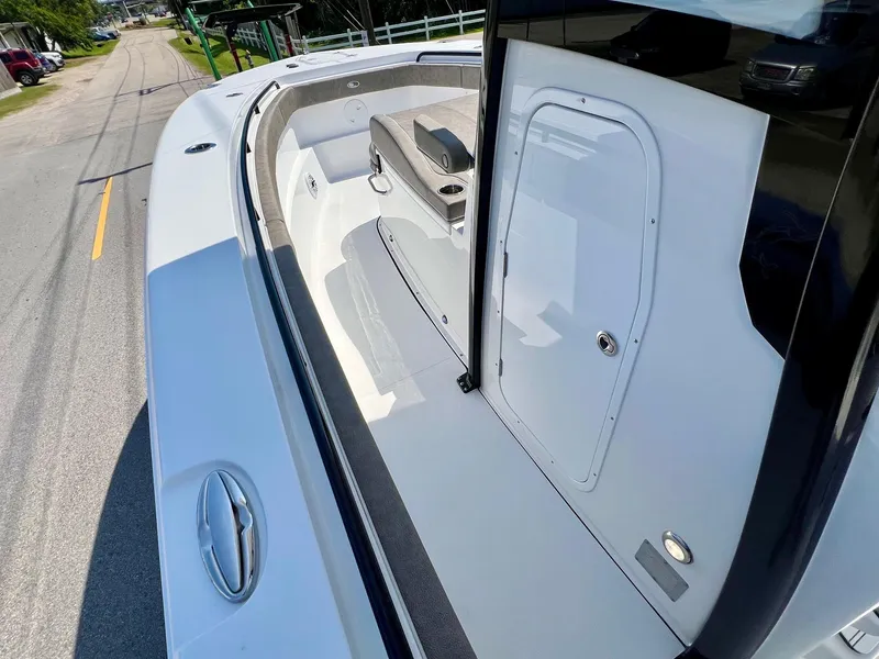 Slide: The Image of 2025 Sea Hunt Gamefish 30 with Coffin Box, showcasing spacious deck and sleek design. - 13